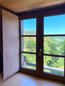 a room with a window with a view at Le Chateau de Busqueilles La Suite in Autoire