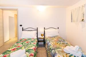 A bed or beds in a room at Appartamenti di Catia a due passi dal mare