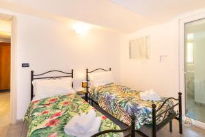 A bed or beds in a room at Appartamenti di Catia a due passi dal mare