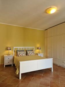 a bedroom with a large bed and two night stands at Country House with Pool in Nerola in Nerola +18 photos