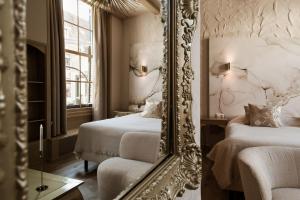 Postel nebo postele na pokoji v ubytování Boutique Hotel Elburg met Tapperij