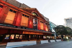 a building with an advertisement on the side of it at The Capitol Hotel Sydney in Sydney