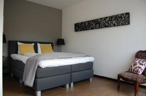 Postel nebo postele na pokoji v ubytování Kunsthaus Apartments