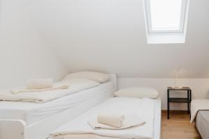 En eller flere senge i et værelse på nice2be Violet - Augsburg Zentrum