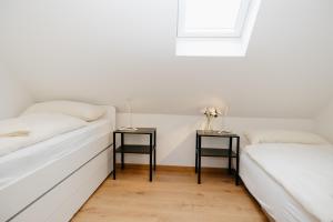 En eller flere senge i et værelse på nice2be Violet - Augsburg Zentrum