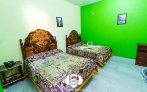 Postel nebo postele na pokoji v ubytování Hotel Villas de Plan