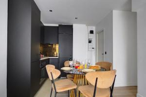 a dining room with a table and chairs at Bluestay 123 - Superb apartment in Paris in Paris +20 photos