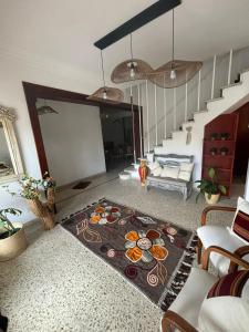 a living room with a table with food on it at Hostal El Vendaval in Miramar