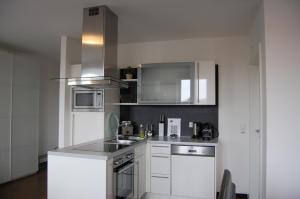 Kuchyň nebo kuchyňský kout v ubytování Kunsthaus Apartments