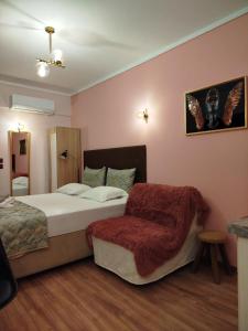 A bed or beds in a room at Manina Superior Apartment