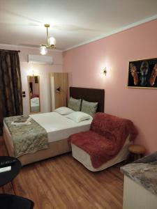 A bed or beds in a room at Manina Superior Apartment