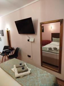 A bed or beds in a room at Manina Superior Apartment