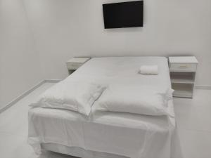 Postel nebo postele na pokoji v ubytování Pousada CHOW