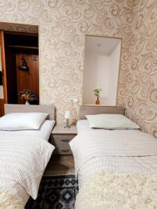 Postel nebo postele na pokoji v ubytování Hotel bereka