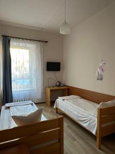Postel nebo postele na pokoji v ubytování Hotel Haga