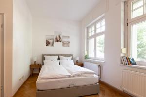 Postel nebo postele na pokoji v ubytování Gästehaus am Winckel