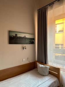 Łóżko lub łóżka w pokoju w obiekcie Hotel Haga