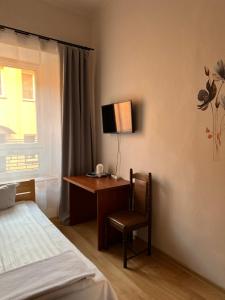 Łóżko lub łóżka w pokoju w obiekcie Hotel Haga
