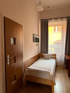 Łóżko lub łóżka w pokoju w obiekcie Hotel Haga