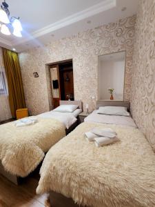 Postel nebo postele na pokoji v ubytování Hotel bereka