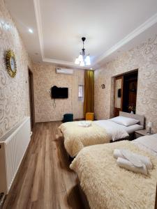 Postel nebo postele na pokoji v ubytování Hotel bereka