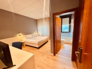 Postel nebo postele na pokoji v ubytování Hotel Pex Mantova