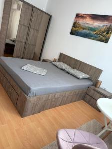 a bedroom with a bed in a room at Studio Central PCS in Bucharest