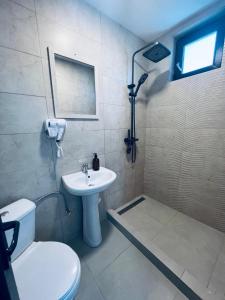 a bathroom with a sink and a toilet and a shower at Star Boutique Villa in Constanţa