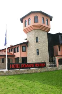 a building with a sign that reads hotel domineering posttec at Hotel Domaine Peshtera in Peshtera