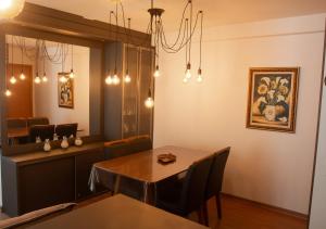 a dining room with a table and a mirror at Apto 407 Torre 4 Vila II in Barra Velha +3 photos