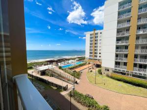a view of the beach from a balcony of a building at Apto 407 Torre 4 Vila II in Barra Velha