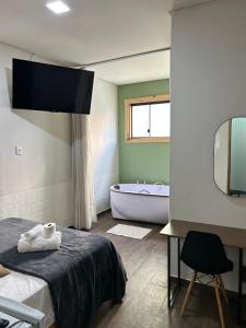 Hotel Chão Mineiro客房内的一张或多张床位