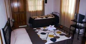 Letto o letti in una camera di Hotel Posada Los Delfines