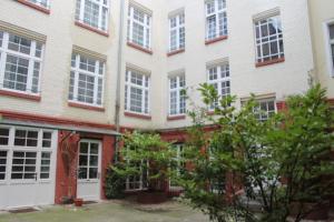 an exterior view of a building with many windows at Erlanger Hof in Berlin
