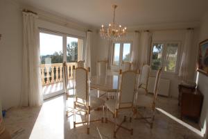 a dining room with a table and chairs at Mimo - sea view villa with private pool in Moraira-Teulada in Moraira