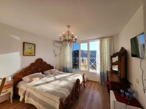 Postel nebo postele na pokoji v ubytování Sighnaghi Art Hotel