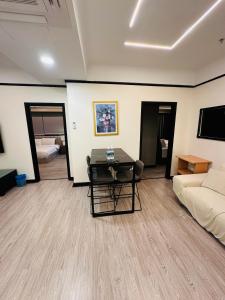 A television and/or entertainment centre at TaheeenS Suites at Berjaya Times Square