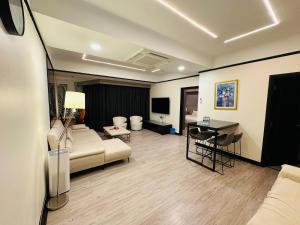 A seating area at TaheeenS Suites at Berjaya Times Square