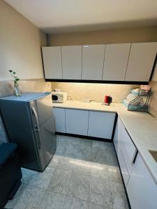 A kitchen or kitchenette at TaheeenS Suites at Berjaya Times Square