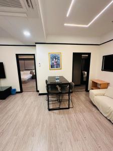 A television and/or entertainment centre at TaheeenS Suites at Berjaya Times Square