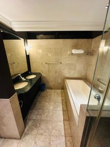 A bathroom at TaheeenS Suites at Berjaya Times Square
