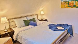 Katil atau katil-katil dalam bilik di 4 Sterne Ferienhaus Marlene mit großem Garten