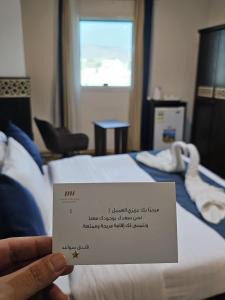 Postel nebo postele na pokoji v ubytování فندق سواعد العالمية