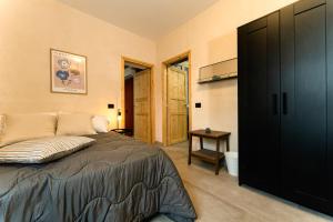 Ένα ή περισσότερα κρεβάτια σε δωμάτιο στο Residence La Corte - Bilocale 1