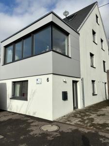 a white house with large windows at IW6 in Meersburg