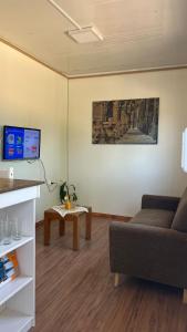 a living room with a couch and a table at Las Marinas Playa Grande 1 in Piriápolis