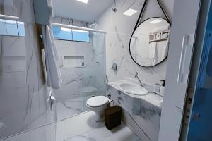 a bathroom with a toilet and a sink and a mirror at Mini Loft Siena in Sinop +62 photos