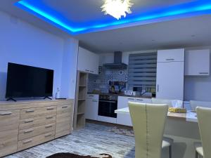 Kuchyň nebo kuchyňský kout v ubytování Appart Chez willi