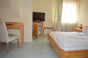 TV a/nebo společenská místnost v ubytování Alte Post - Hotel Am Rhein-Ufer Laufenburg