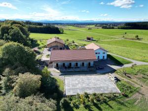 an aerial view of a house in a field at Hof Kaltenbrunn in Aying